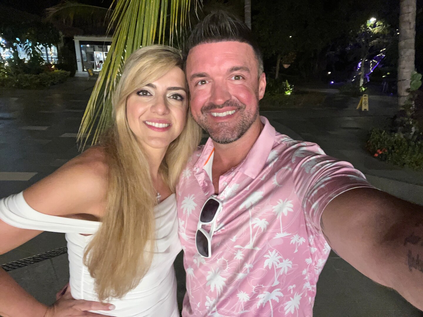 Sarah and Jeremy McQuinn together during an evening of personal travel, shown with Sarah centered for her advisor profile.